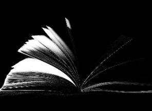 A black and white photo of an open book.